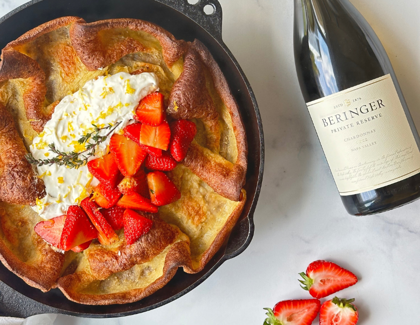 dutch baby with balsamic strawberries and whipped mascarpone cream with private reserve chardonnay